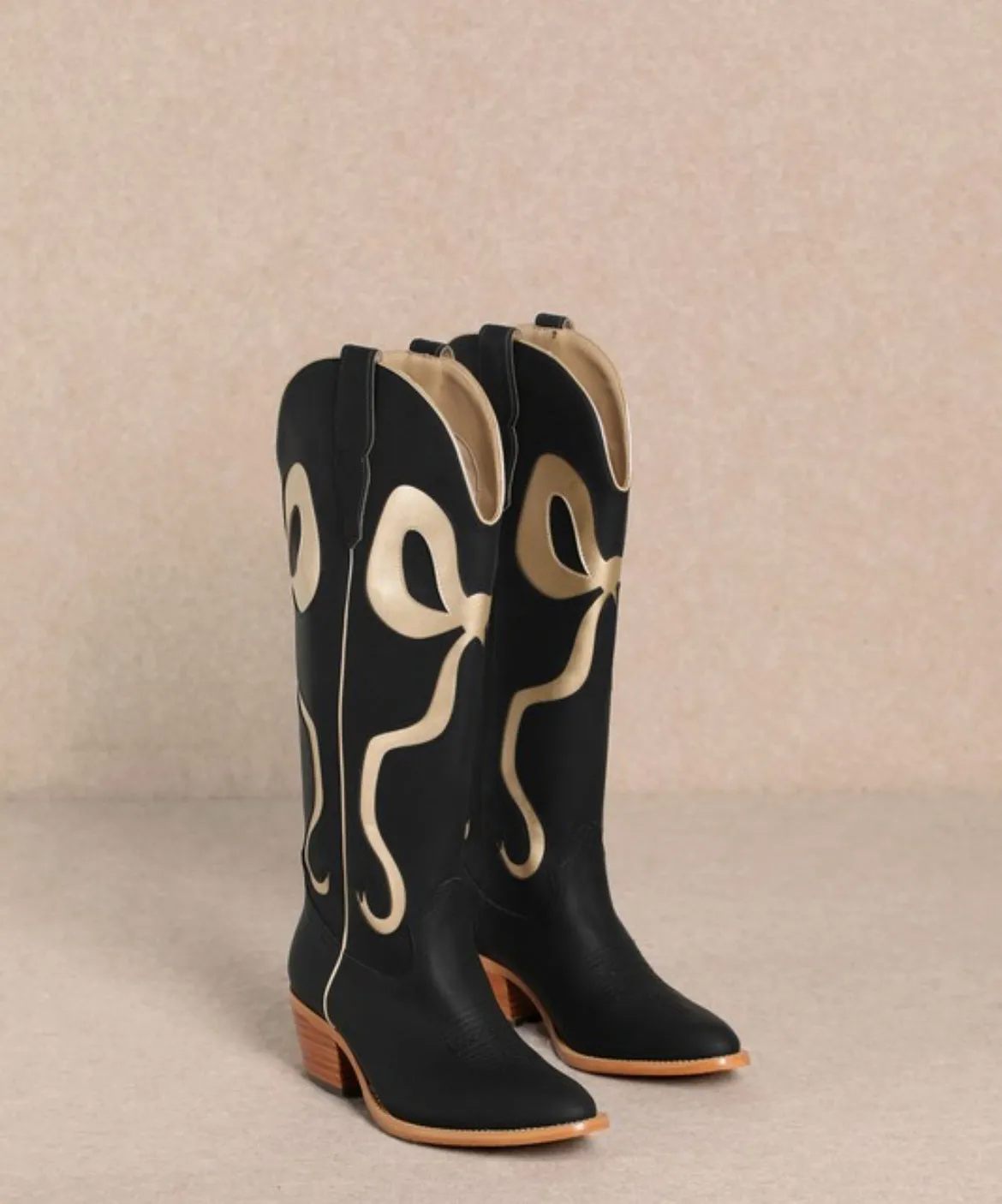Golden bow detail black boots